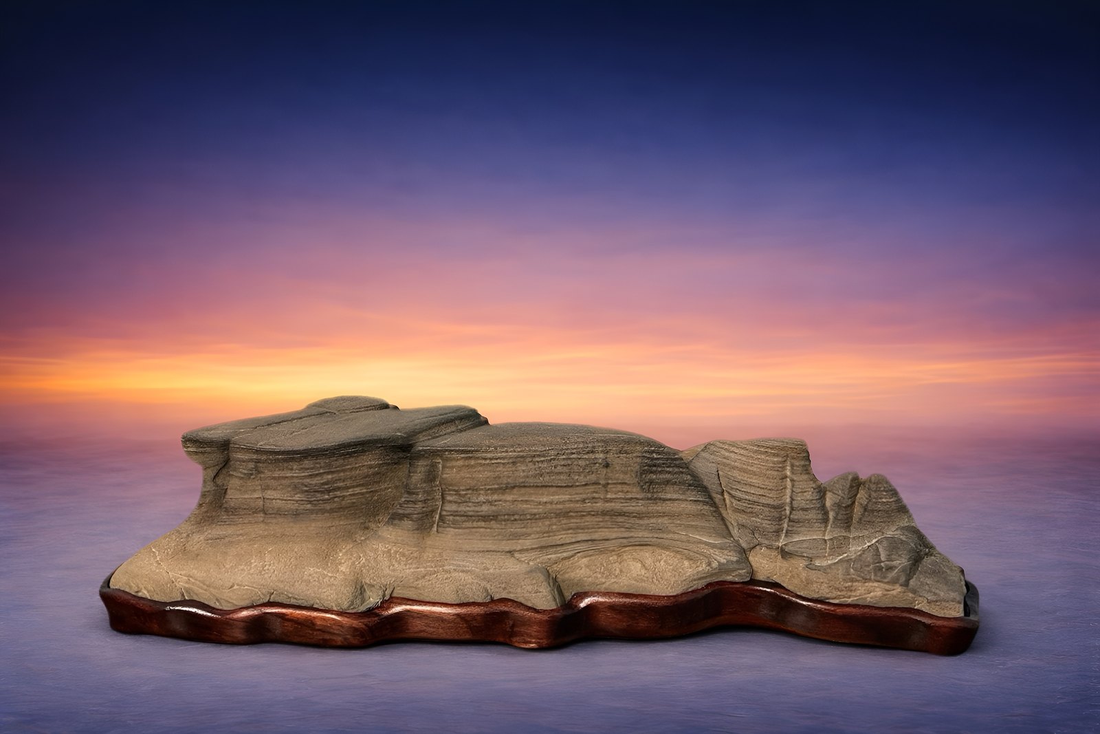 Rempō-seki (Mountain Range Stone). This sandstone suiseki evokes the rugged beauty of an ancient desert landscape, where thousands of years of erosion have sculpted a dramatic chain of mountains and ridges.