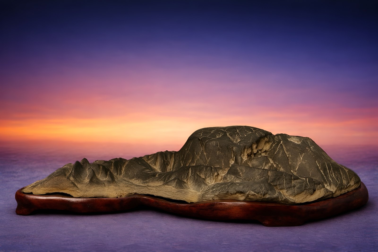 Sansui Kei-seki (Landscape Stone). This suiseki evokes the quiet harmony of a timeless natural landscape, inviting contemplation through its serene composition and gentle balance.