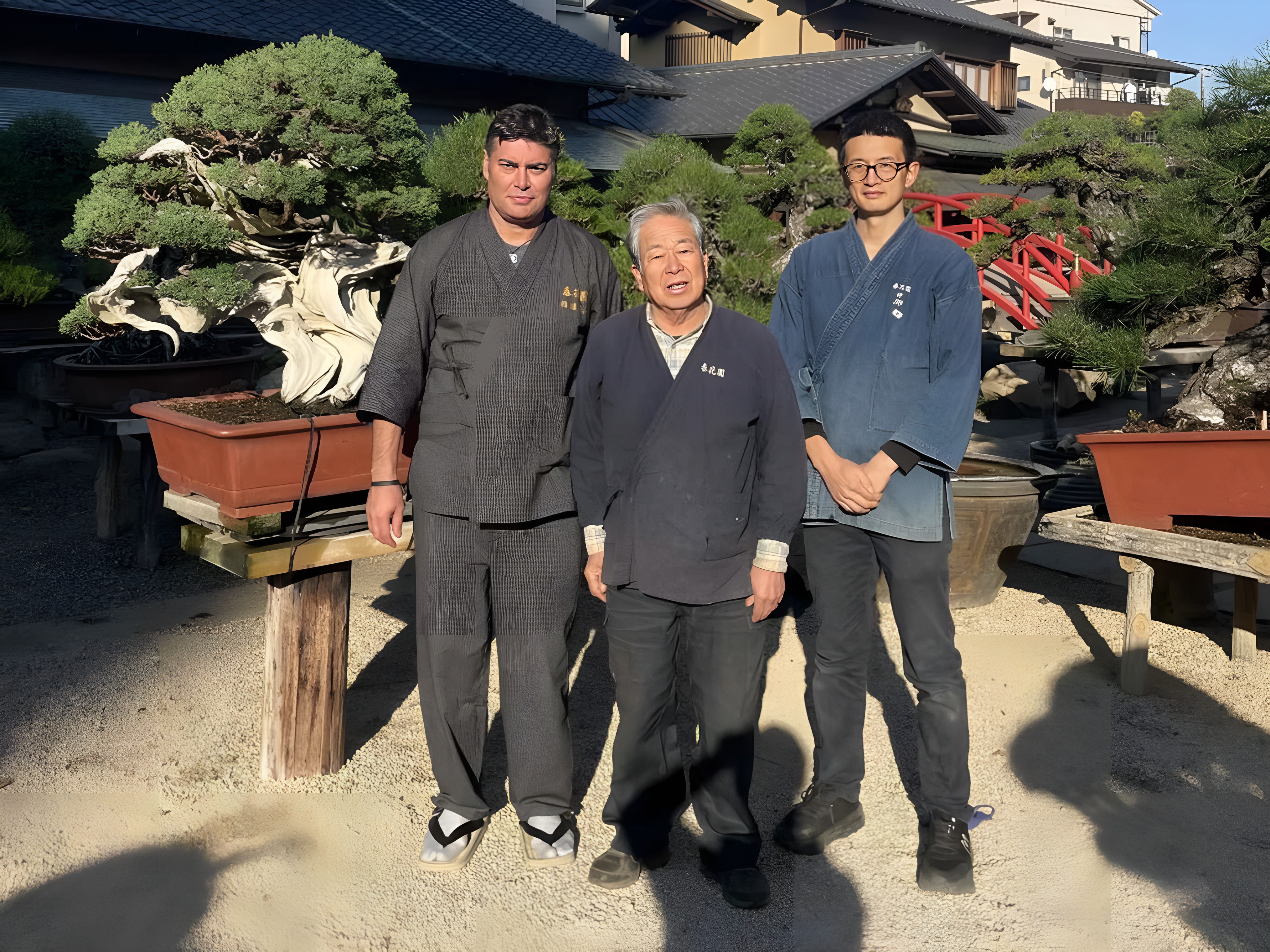 III Iemoto Kobayashi Ippū (center), senpai Jin Yasufumi (right), and the author (left) in the bonsai garden of the Shunkaen Bonsai Museum, during the author’s in-person period of study in Keidō in autumn 2025.